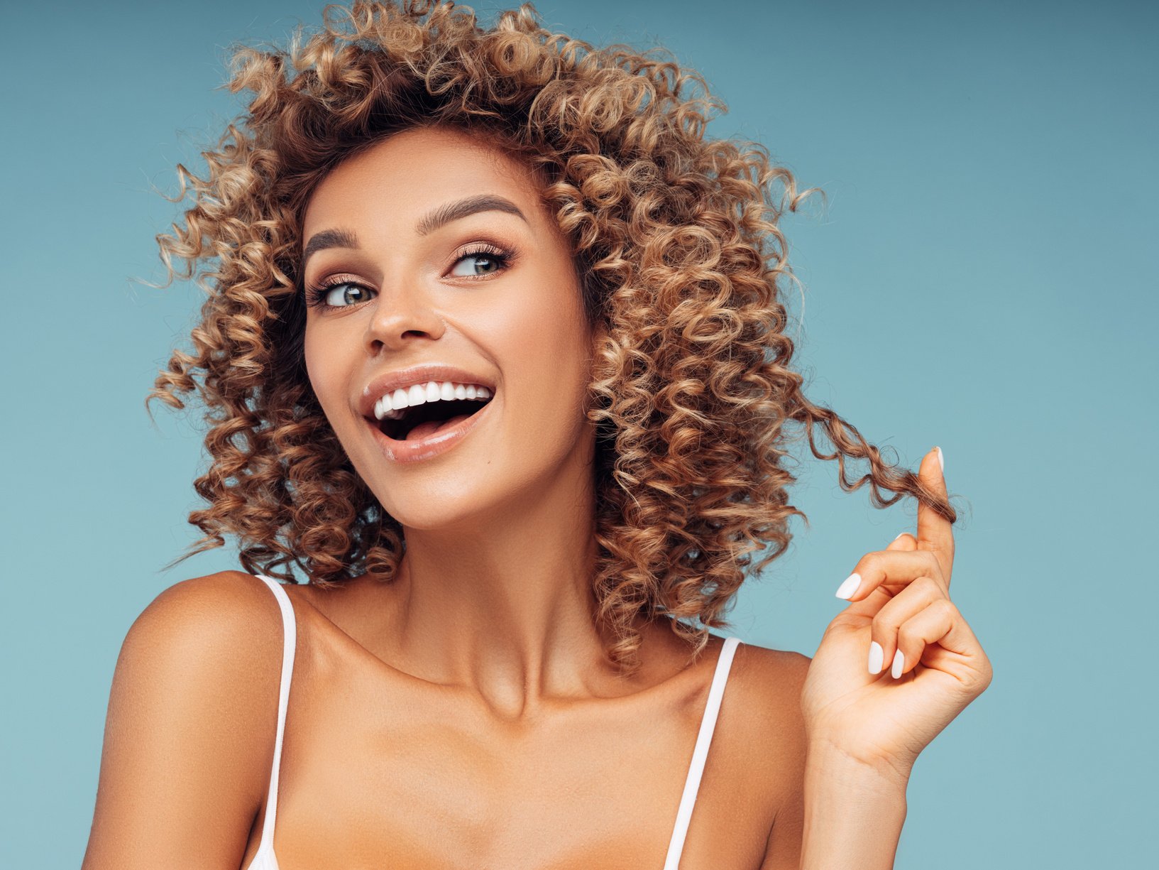 Beautiful young woman with curly hair